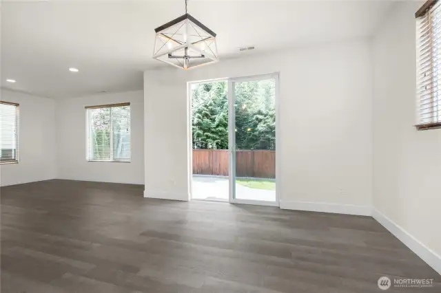 Open dining area with easy access to the backyard, blending indoor and outdoor living.