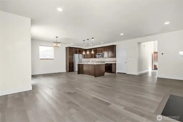 Bright, open living room designed to comfortably fit your furniture and personal style.