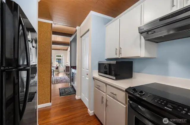 Stainless steel appliances compliment the kitchen that flows seamlessly into the living space.