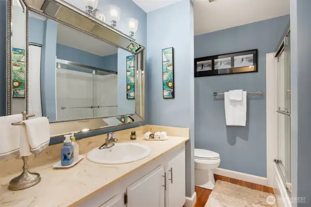 Bathroom offering abundant countertop and storage space.
