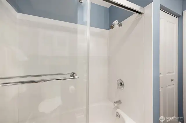 Bathroom featuring spacious bathtub and shower.