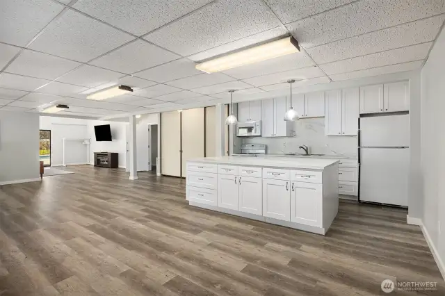 Clubhouse entertainment room with kitchen.