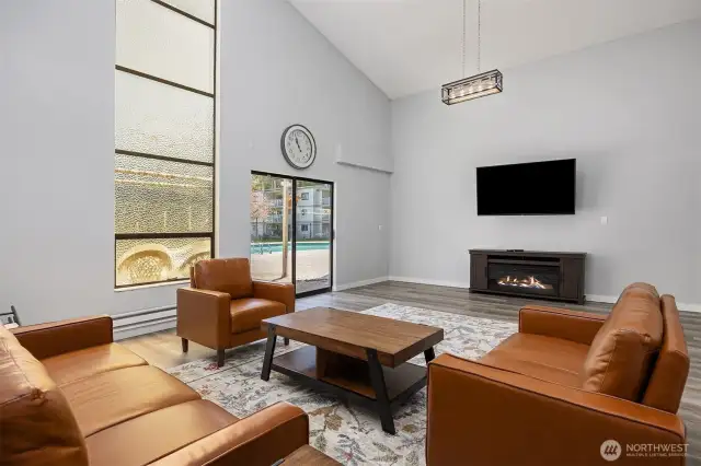 Additional entertainment room in clubhouse leading to pool area through sliding glass doors.