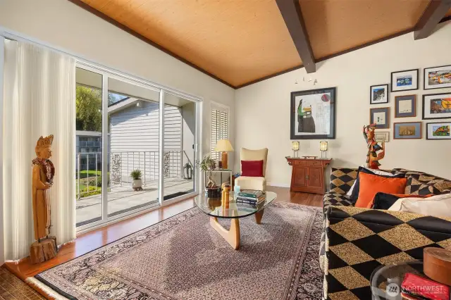Sliding glass door off the living room open to a balcony and fill the space with natural light.