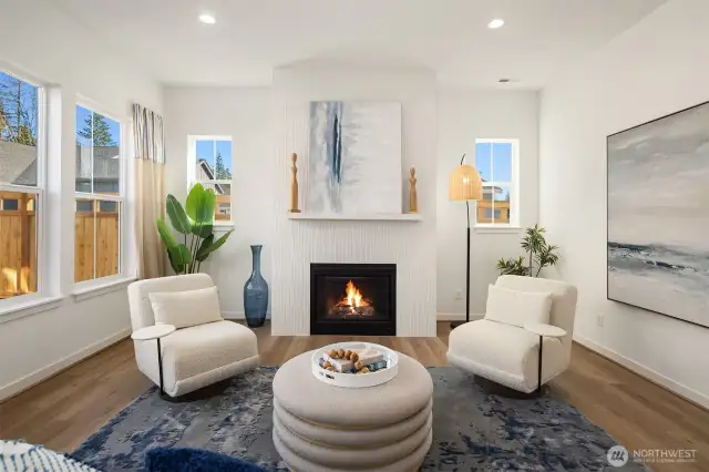Great room with fireplace.  Photos are for illustrative purposes