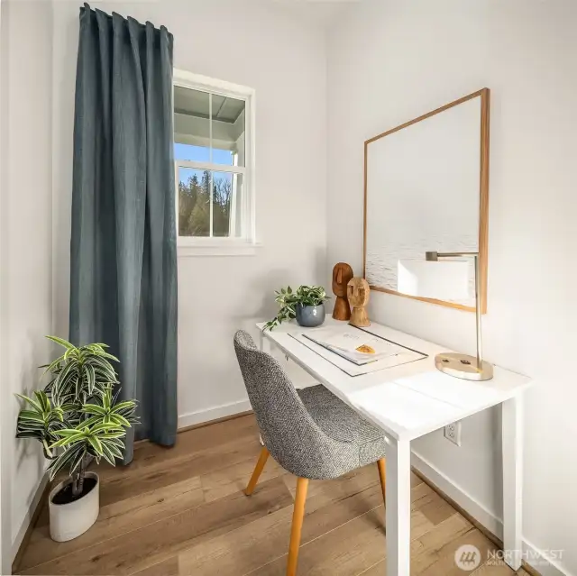 Workspace with window behind kitchen area.  Photos are for illustrative purposes