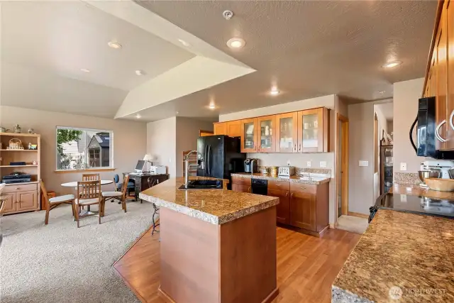 Large kitchen with granite/family room with views