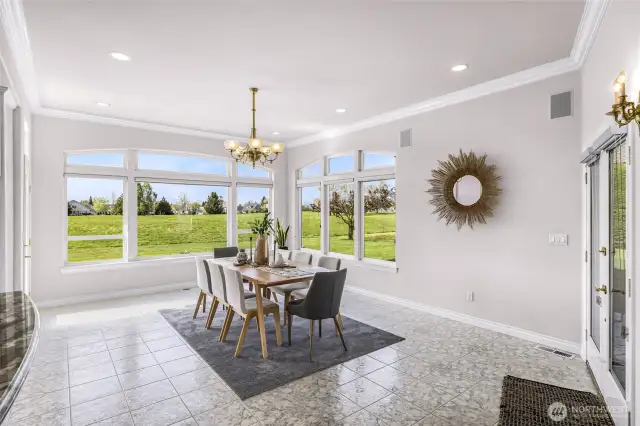 Dining Room surrounded on all sides by windows