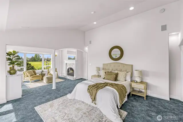 Main floor Primary Bedroom Suite with separate sitting room and fireplace