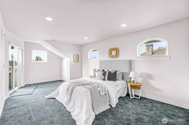 Upstairs Bedroom (3 total bedrooms upstairs including den). Slider leads to outdoor deck.
