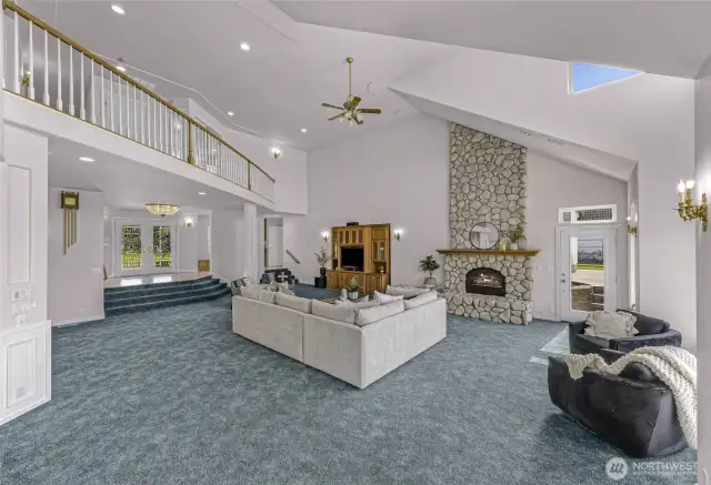 Custom built home, with one of a kind features like the river rock fireplace and crystal entry chandelier