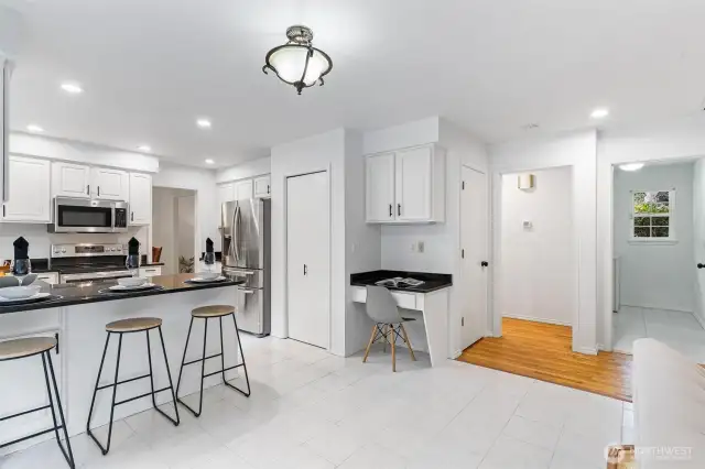 Convenient planning desk off the kitchen and a pantry for added storage.