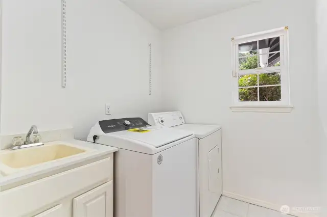 Laundry room with convenient sink.