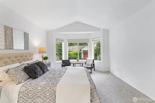 Primary bedroom boasts a bay window with sitting area and a 5 piece private bath.