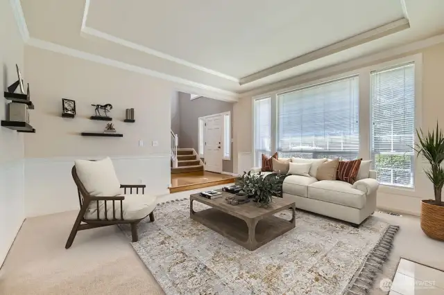 In the sunken living room, abundant light enters through large view windows.