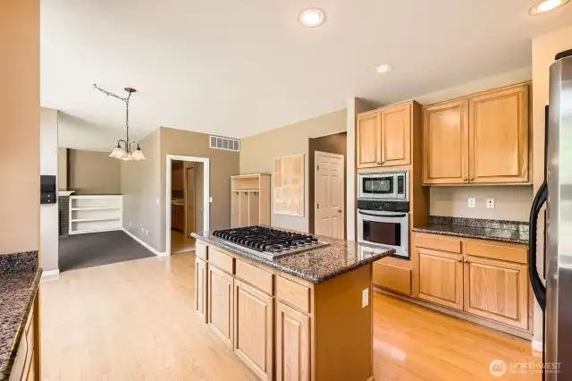 The abundant cabinets, counterspace and the island create a wonderful kitchen to create meals together.