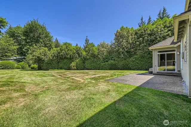 The landscaping around this wonderful, level yard is well-manicured and provides total seclusion.