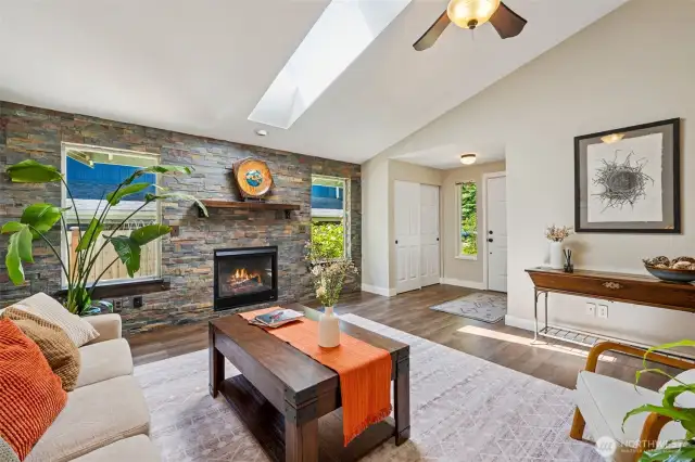 Stay warm and cozy with the gas fireplace and custom natural stone accent surrounding.