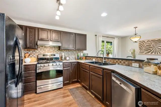 Open and inviting kitchen with tons of storage and a pantry for all your essentials.