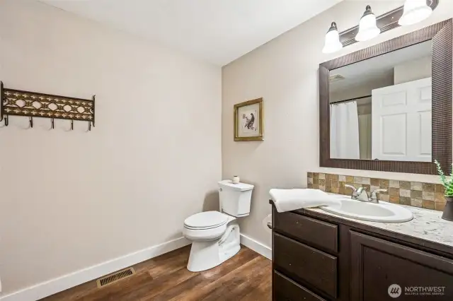 Spacious full guest bathroom with plenty of room and functional layout.