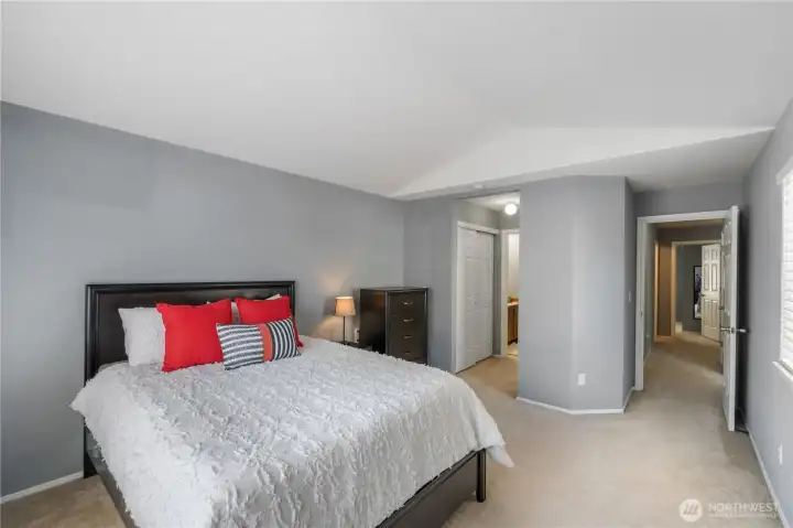 Primary bedroom with bath and dual closets