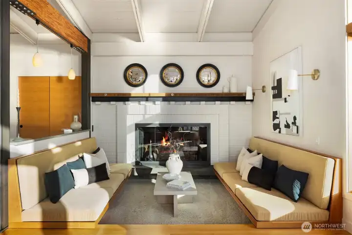 A cozy spot around the fireplace with the built-in benches.