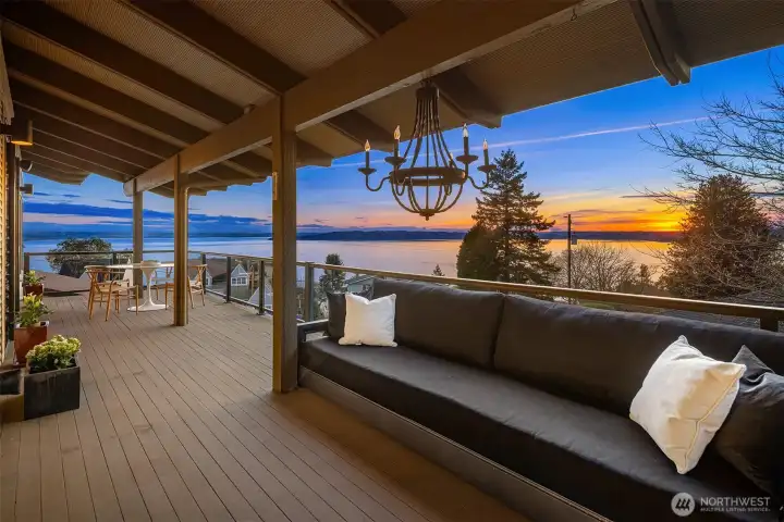 The covered wrap around deck represents the perfect spot for "al fresco" meals all year round.