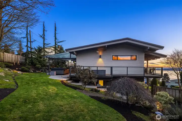 The upper garden is fully fenced and so perfect for furry friends. The deck wraps around back to the main living area and primary ensuite.