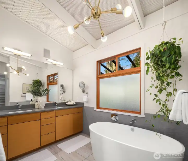 Vaulted ceilings in both bedroom and bathroom.