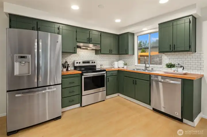 Spacious kitchen offering ample storage.