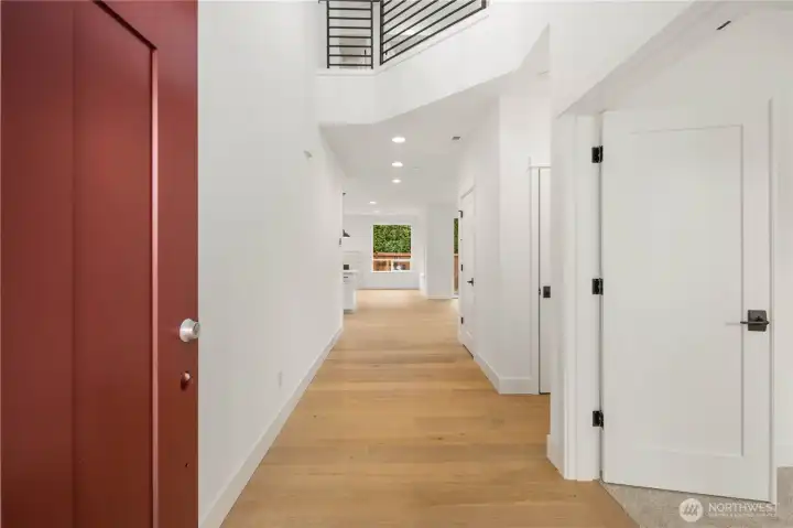 The spacious entry hallway welcomes you with tall ceilings, crisp white millwork, and a clear sightline toward the main living spaces for an immediate sense of openness. Durable engineered hardwood floors extend through the main level, offering both style and everyday convenience.    These photos are from lot 3 at Gooden Hollow, the actual home for sale. However, other homes may vary, so all photos, renderings, site maps, and floorplans are for visualization purposes only. Plans, colors, building orientation, finishes, home outlook, and other details can and WILL vary.