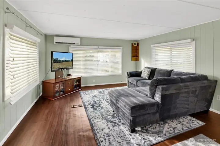 Living room facing south and the driveway has territorial Chuckanut Mountain views. Three big window face East, South and West for all-day light.