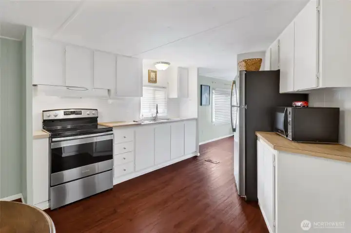 Kitchen with newer stove/oven and refrigerator