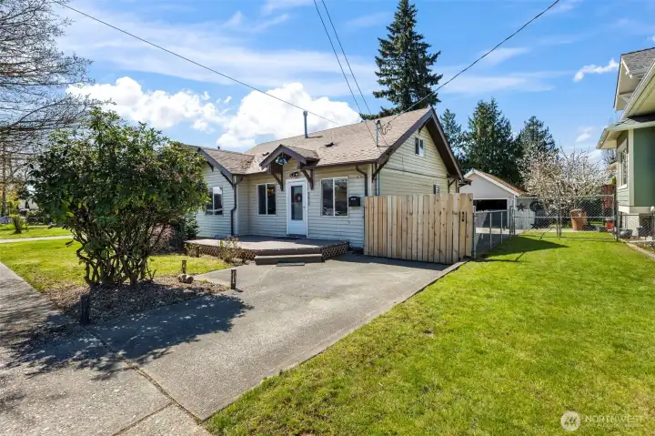 Long gated driveway leads to a oversized four car detached garage.