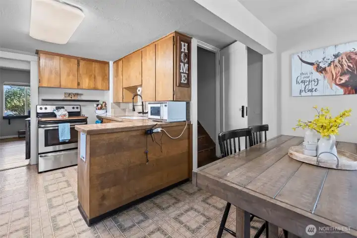 Off the kitchen you will find the stairway leading to the two bedrooms upstairs.