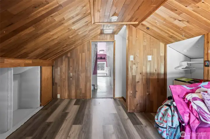 directly across the way in the finished attic is the second bedroom.