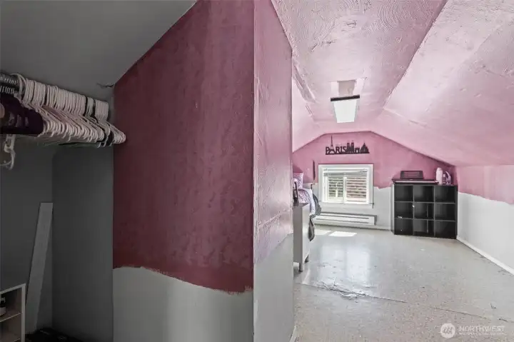 A small pocket closet for bedroom number three right when you enter the room.