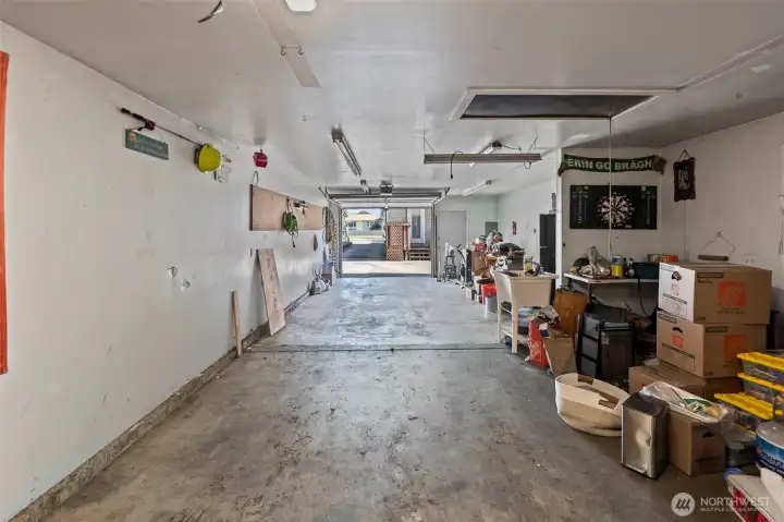 The interior of the four car garage is fully finished with heat and electricity.