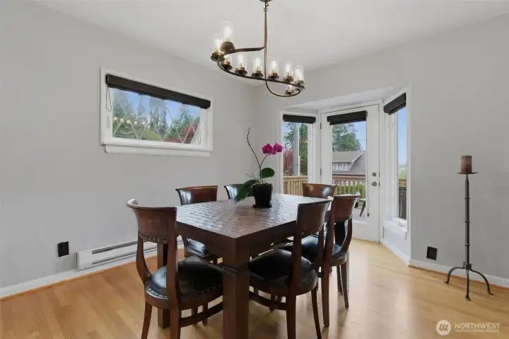 Dining room opens up to the front deck with views of the water and sunsets.