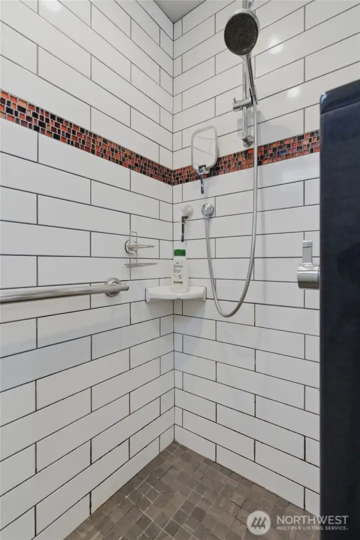 Main level bathroom with a walk-in shower.