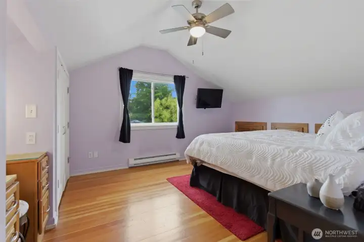 Upstairs primary bedroom with custom built-in's.