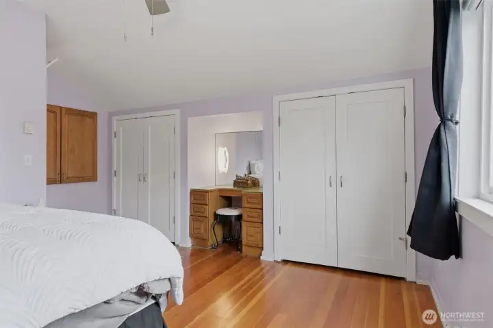 Upstairs primary includes his and her closets.