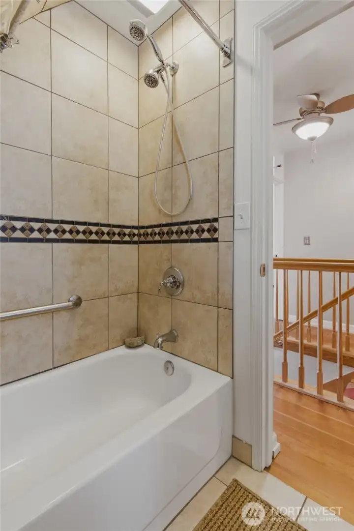 Upstairs bathroom with a tub.