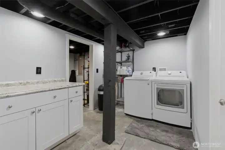 Washer & dryer and lots of space to keep your laundry organized.