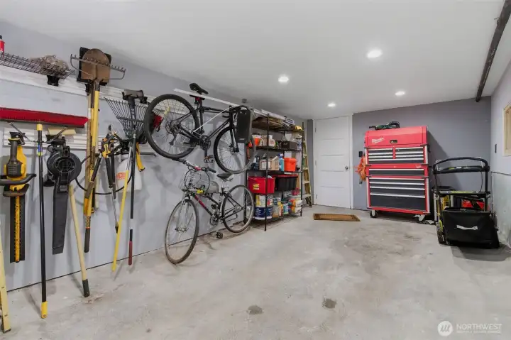 Garage with space for your car and toys. Fast EV charger located right next to it.