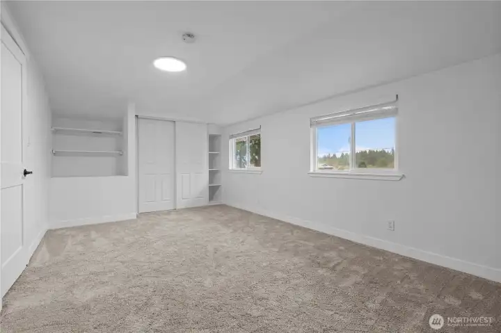 Second upstairs bedroom with cute alcove shelving.