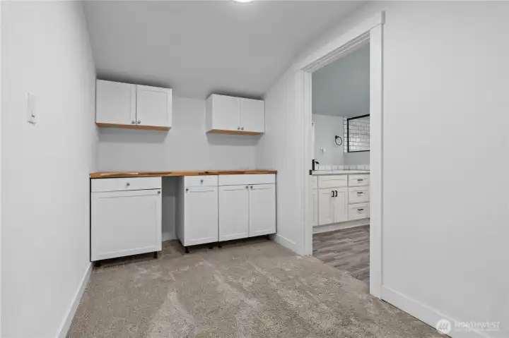 Upstair landing space with cabinets. Versatile flex space.