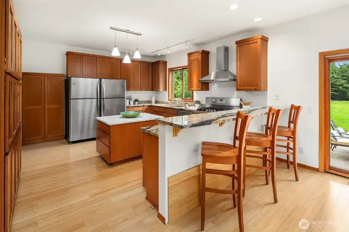 Breakfast bar with granite countertops.