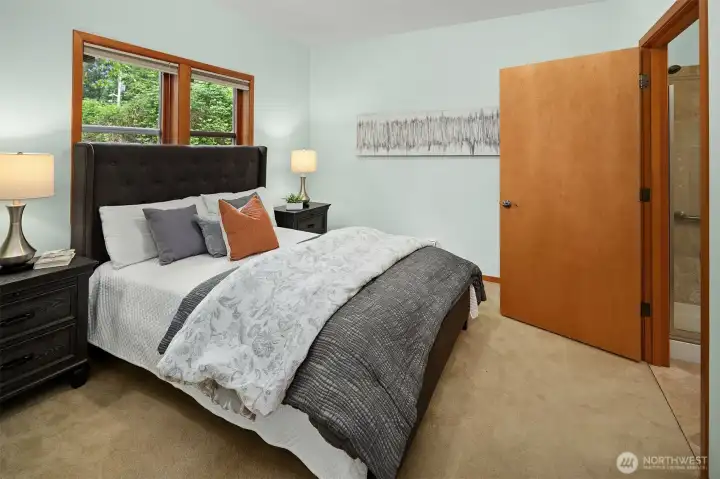 Guest suite on lower level features ensuite bath and walk-in closet.