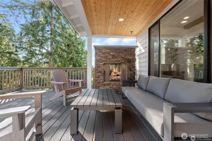 Expansive deck with covered area and fireplace